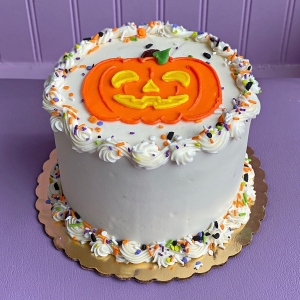 SMILEY CUTE JACK O LANTERN PUMPKIN FACE WITH SPRINKLES HALLOWEEN HOLIDAY FALL BIRTHDAY CAKE IN CHICAGO ILLINOIS