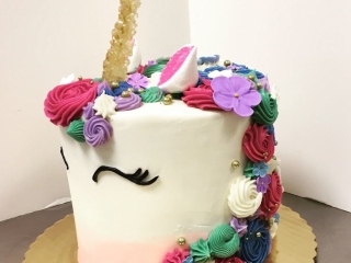 GEM TONE CUTE RAINBOW UNICORN COVERED CAKE WITH FLOWERS, ROSETTES, AND ROCK CANDY MAGIC HORN FOR GIRLY BIRTHDAY PARTY CELEBRFATION CAKE FOR KIDS IN CHICAGO