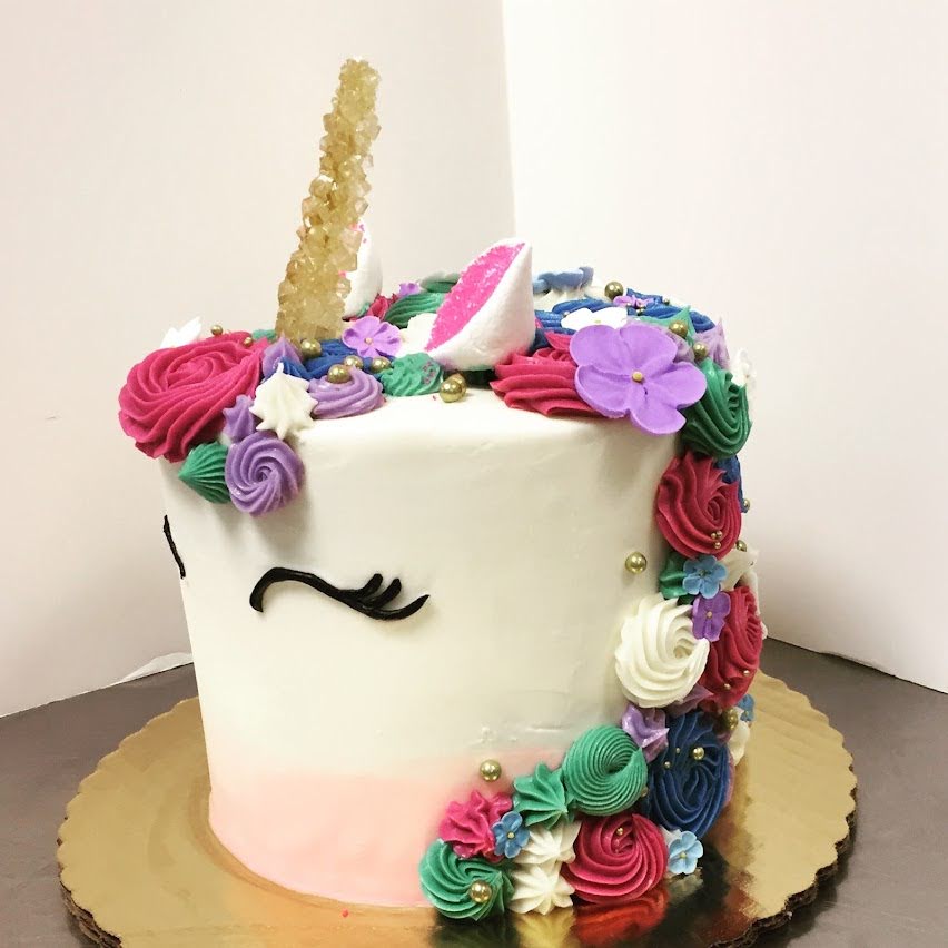 GEM TONE CUTE RAINBOW UNICORN COVERED CAKE WITH FLOWERS, ROSETTES, AND ROCK CANDY MAGIC HORN FOR GIRLY BIRTHDAY PARTY CELEBRFATION CAKE FOR KIDS IN CHICAGO