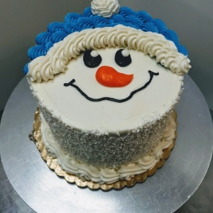 ROSETTE AND SUGAR TEXTURED SNOWMAN FACE AND HAT CUTE CARTOON WINTER HOLIDAY CHRISTMAS BIRTHDAY CAKE IN CHICAGO ILLINOIS